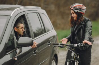 Cyclist speaking to a motorist