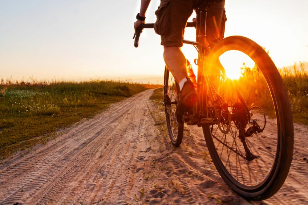 Cut off shot of man gravel biking.
